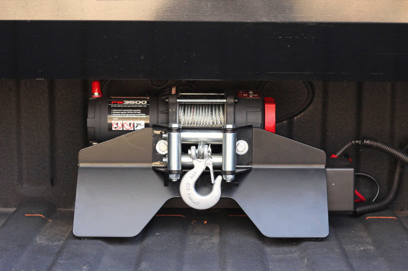 Short mounting plate for winch for pickup truck bed